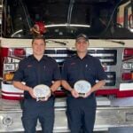 Ryan Fuzi Prince Rupert Fire Fighter of the Year (left), and Dylan Sidoni, Fire Officer of the Year, pose with their plaques at the Prince Rupert Fire Hall. Prince Rupert Fire Rescue