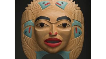 Dale Campbell's "Woman who Brought the Salmon" mask made of alder, abalone and pigment.
